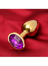 Золотистая анальная пробка с фиолетовым кристаллом - Сима-Ленд - купить с доставкой в Краснодаре